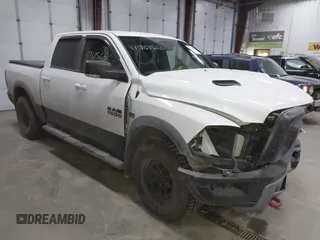 2016 Ram 1500 Rebel z VIN 1C6RR7YT6GS108472, wystawiony jako IAAI lot #41761560 z przebiegiem 101 132 mil mil oraz . Historia ofert i sprzedaży dostępna na DreamBid. Obrazek 1.