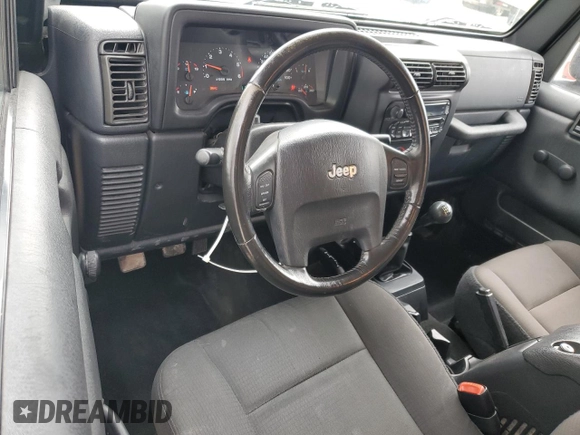 2006 Jeep Wrangler X with VIN 1J4FA39SX6P719070, listed as a Copart auction lot 55598455 with 110,741 mi miles and Salvage title. Bid and sale history available at DreamBid. Image 8.