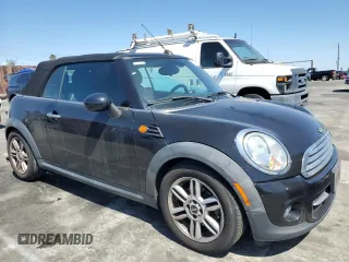 2015 MINI Convertible with VIN WMWZN3C56FT266838, listed as a Copart auction lot 50250745 with 60,331 mi miles and Salvage title. Bid and sale history available at DreamBid. Image 4.