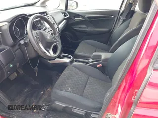 2015 Honda Fit LX z VIN 3HGGK5H54FM728448, wystawiony jako IAAI lot #41538650 z przebiegiem 115 450 mil mil oraz . Historia ofert i sprzedaży dostępna na DreamBid. Obrazek 5.