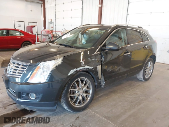 2014 Cadillac SRX Premium Collection z VIN 3GYFNGE38ES606731, wystawiony jako IAAI lot #41844450 z przebiegiem 156 541 mil mil oraz . Historia ofert i sprzedaży dostępna na DreamBid. Obrazek 17.