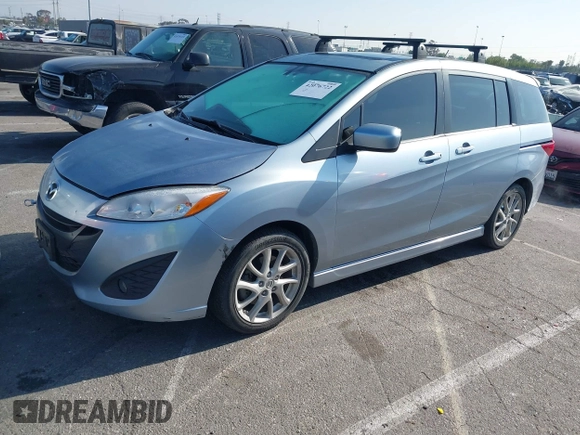 2012 Mazda 5 Grand Touring with VIN JM1CW2DL6C0126640, listed as a IAAI auction lot 42076722 with 124,412 mi miles and . Bid and sale history available at DreamBid. Image 2.