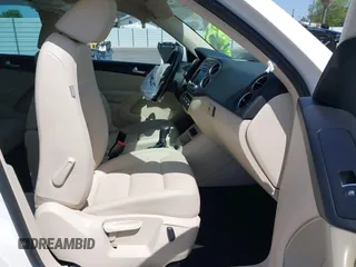 2014 Volkswagen Tiguan SEL with VIN WVGAV3AX9EW512956, listed as a IAAI auction lot 42110002 with 136,034 mi miles and . Bid and sale history available at DreamBid. Image 5.