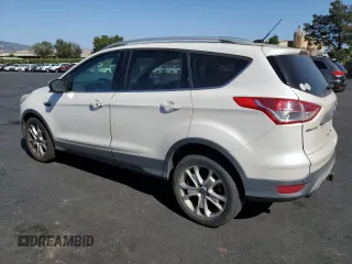 2014 Ford Escape Titanium z VIN 1FMCU0J9XEUD01904, wystawiony jako Copart lot #61819555 z przebiegiem 217 794 mil mil oraz Czysty tytuł • Clean title. Historia ofert i sprzedaży dostępna na DreamBid. Obrazek 2.