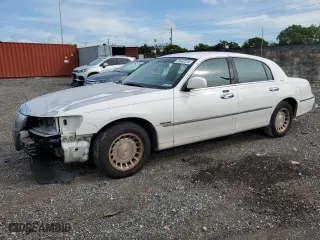 2002 Lincoln Town Car Executive with VIN 1LNHM81W82Y609104, listed as a Copart auction lot 75442374 with 324,612 mi miles and Salvage Title. Bid and sale history available at carsss.com. Image 1.