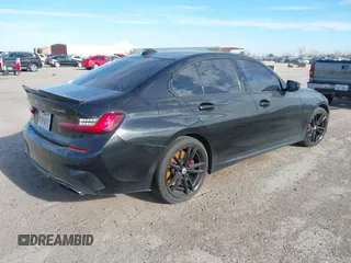 2022 BMW 3 Series M340i xDrive with VIN WBA5U9C08NFM68599, listed as a IAAI auction lot 41260340 with Not Provided miles and . Bid and sale history available at DreamBid. Image 4.
