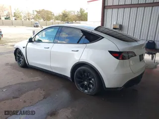 2023 Tesla Model Y Long Range with VIN 7SAYGAEE0PF787216, listed as a IAAI auction lot 41589954 with 17,985 mi miles. Bid and sale history available at carsss.com. Image 3.