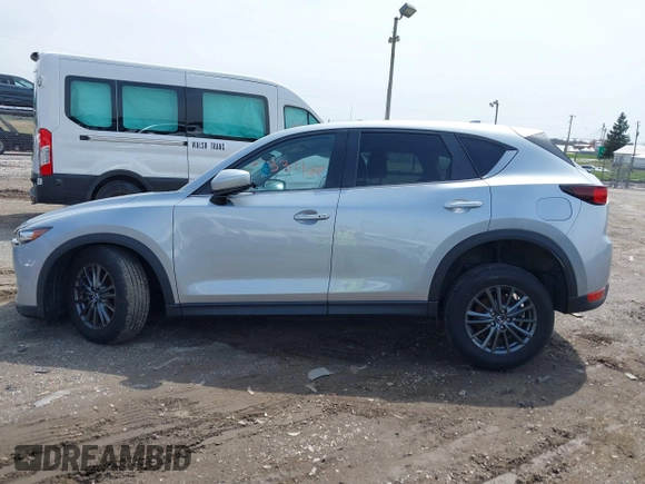 2020 Mazda CX-5 Touring with VIN JM3KFACM9L0785464, listed as a IAAI auction lot 42023311 with 90,062 mi miles and . Bid and sale history available at DreamBid. Image 14.