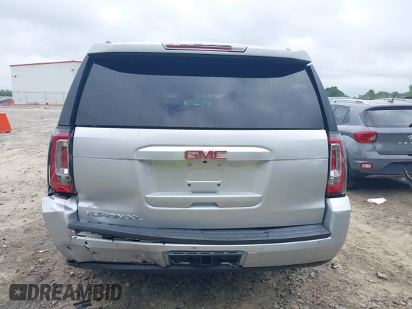 2019 GMC Yukon XL SLT z VIN 1GKS1GKC0KR242408, wystawiony jako IAAI lot #42144783 z przebiegiem Nie podano mil oraz . Historia ofert i sprzedaży dostępna na DreamBid. Obrazek 15.