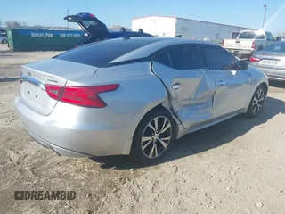 2016 Nissan Maxima SL with VIN 1N4AA6AP6GC448161, listed as a IAAI auction lot 41709077 with 133,288 mi miles and . Bid and sale history available at DreamBid. Image 4.