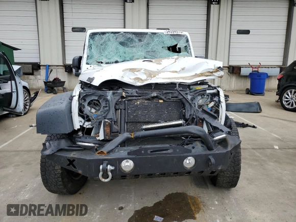 2013 Jeep Wrangler Unlimited Sport RHD with VIN 1C4BJWKG9DL689639, listed as a Copart auction lot 54594975 with 256,837 mi miles and Salvage title. Bid and sale history available at DreamBid. Image 5.