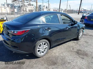 2016 Scion iA z VIN 3MYDLBZV0GY123351, wystawiony jako IAAI lot #41736327 z przebiegiem 86 804 mil mil oraz . Historia ofert i sprzedaży dostępna na DreamBid. Obrazek 4.