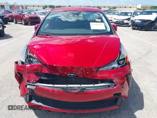 2021 Toyota Prius L Eco with VIN JTDKAMFU4M3145215, listed as a IAAI auction lot 42281566 with 74,220 mi miles and . Bid and sale history available at DreamBid. Image 6.