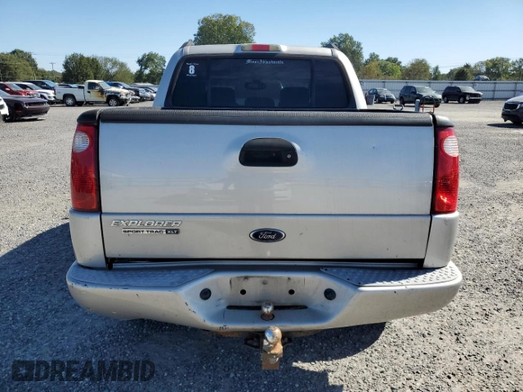 2004 Ford Explorer Sport Trac XLS z VIN 1FMDU77K24UA03885, wystawiony jako Copart lot #75434684 z przebiegiem Nie podano mil oraz Szkoda całkowita • Salvage title. Historia ofert i sprzedaży dostępna na DreamBid. Obrazek 6.