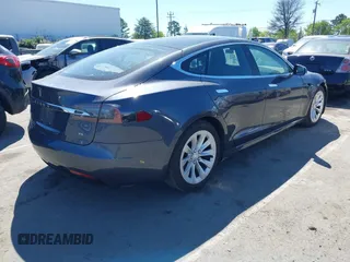 2017 Tesla Model S 100D with VIN 5YJSA1E20HF198503, listed as a IAAI auction lot 41843782 with 77,281 mi miles and . Bid and sale history available at DreamBid. Image 4.