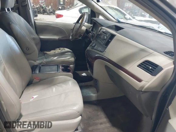 2011 Toyota Sienna XLE AAS with VIN 5TDYK3DC8BS111639, listed as a IAAI auction lot 42108488 with 300,872 mi miles and . Bid and sale history available at DreamBid. Image 5.