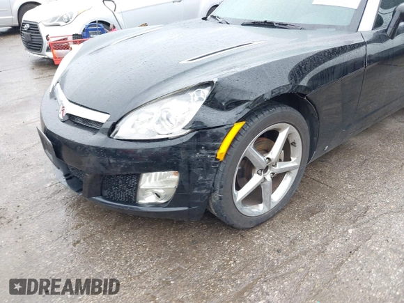 2009 Saturn Sky z VIN 1G8MN35B59Y104152, wystawiony jako IAAI lot #42308236 z przebiegiem 190 823 mil mil oraz . Historia ofert i sprzedaży dostępna na DreamBid. Obrazek 6.