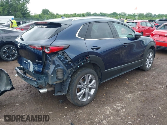 2022 Mazda CX-30 S Premium with VIN 3MVDMBDL0NM413545, listed as a IAAI auction lot 42493594 with 57,013 mi miles and . Bid and sale history available at DreamBid. Image 4.