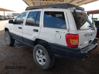 2000 Jeep Grand Cherokee Laredo z VIN 1J4GW48S4YC299149, wystawiony jako IAAI lot #42347792 z przebiegiem 229 007 mil mil oraz . Historia ofert i sprzedaży dostępna na DreamBid. Obrazek 3.