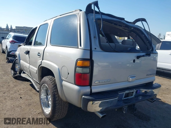 2004 Chevrolet Tahoe LS with VIN 1GNEC13T64J282970, listed as a IAAI auction lot 41879458 with 205,952 mi miles and . Bid and sale history available at DreamBid. Image 3.