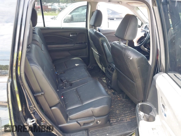 2017 Honda Pilot Touring with VIN 5FNYF5H91HB038268, listed as a IAAI auction lot 42786448 with 62,195 mi miles and . Bid and sale history available at DreamBid. Image 8.