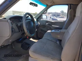1997 Ford F-150 XL with VIN 1FTDX18W4VKC95711, listed as a IAAI auction lot 42197302 with 287,660 mi miles and . Bid and sale history available at DreamBid. Image 5.
