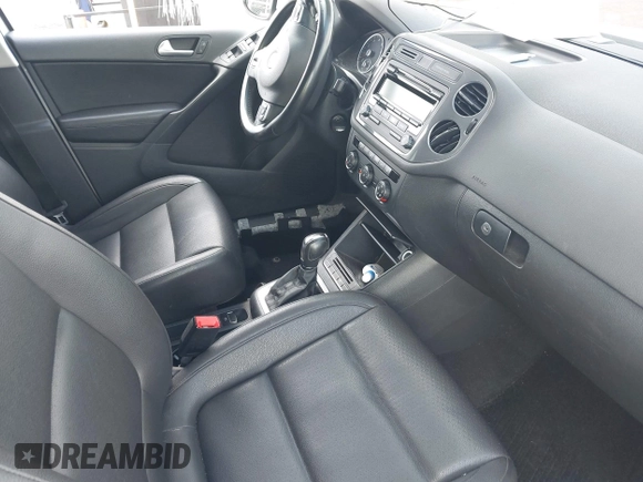 2014 Volkswagen Tiguan S with VIN WVGBV3AX0EW589381, listed as a IAAI auction lot 42186999 with 144,137 mi miles and . Bid and sale history available at DreamBid. Image 5.