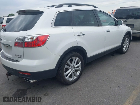 2012 Mazda CX-9 Grand Touring with VIN JM3TB3DA1C0356335, listed as a IAAI auction lot 42658284 with 141,537 mi miles and . Bid and sale history available at DreamBid. Image 4.