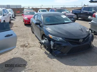 2019 Toyota Camry LE z VIN 4T1B11HK1KU167153, wystawiony jako IAAI lot #41656477 z przebiegiem 103 796 mil mil oraz . Historia ofert i sprzedaży dostępna na DreamBid. Obrazek 1.