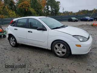 2004 Ford Focus with VIN 3FAFP37Z94R101447, listed as a Copart auction lot 74570054 with 162,166 mi miles and Salvage title. Bid and sale history available at DreamBid. Image 4.