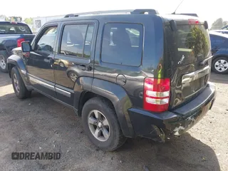 2008 Jeep Liberty Sport with VIN 1J8GP28KX8W227953, listed as a IAAI auction lot 42049588 with 310,901 mi miles. Bid and sale history available at carsss.com. Image 3.