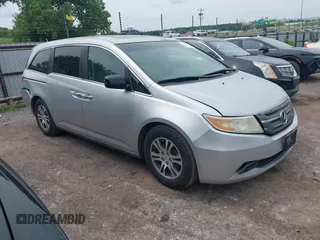 2012 Honda Odyssey EX-L with VIN 5FNRL5H66CB081323, listed as a IAAI auction lot 42465110 with 266,934 mi miles and . Bid and sale history available at DreamBid. Image 1.