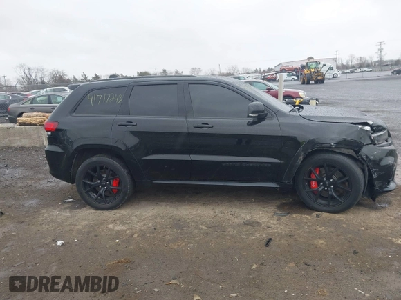 2018 Jeep Grand Cherokee SRT z VIN 1C4RJFDJ2JC391503, wystawiony jako IAAI lot #41717243 z przebiegiem 78 157 mil mil oraz . Historia ofert i sprzedaży dostępna na DreamBid. Obrazek 13.