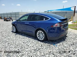 2016 Tesla Model X 70D z VIN 5YJXCAE29GF001522, wystawiony jako Copart lot #56571115 z przebiegiem 129 924 mil mil oraz Szkody całkowita. Historia ofert i sprzedaży dostępna na DreamBid. Obrazek 2.