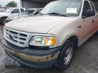 1999 Ford F-150 z VIN 1FTZX1727XNC32012, wystawiony jako IAAI lot #42503195 z przebiegiem 1 805 469 mil mil oraz . Historia ofert i sprzedaży dostępna na DreamBid. Obrazek 6.