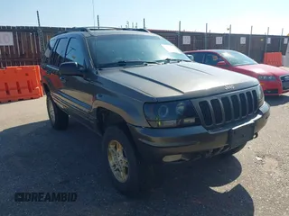 1999 Jeep Grand Cherokee Limited with VIN 1J4GW68N7XC617687, listed as a IAAI auction lot 42433705 with 186,312 mi miles and . Bid and sale history available at DreamBid. Image 1.