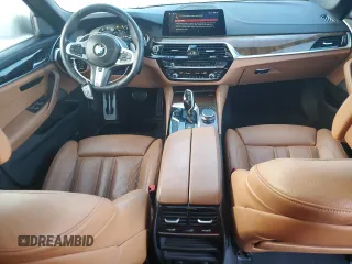 2019 BMW 5 Series M550i xDrive with VIN WBAJB9C57KB288906, listed as a Copart auction lot 79846274 with 61,744 mi miles and Salvage title. Bid and sale history available at DreamBid. Image 8.