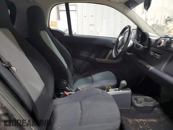 2011 Smart fortwo Pure с VIN WMEEJ3BA5BK480412, выставлен на аукционе Copart как лот 87023194 с пробегом 70 496 миль миль и Списание • Salvage title. История ставок и продаж доступна на DreamBid. Изображение 10.