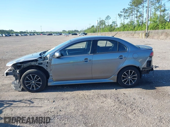2015 Mitsubishi Lancer SE with VIN JA32V2FWXFU023626, listed as a IAAI auction lot 42012381 with 143,981 mi miles. Bid and sale history available at carsss.com. Image 14.
