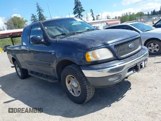 2001 Ford F-150 XL with VIN 1FTRX18L11NA30541, listed as a IAAI auction lot 42143117 with 187,855 mi miles. Bid and sale history available at carsss.com. Image 1.