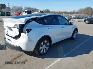 2023 Tesla Model Y Long Range with VIN 7SAYGDEE5PA094253, listed as a IAAI auction lot 41701966 with 29,458 mi miles and . Bid and sale history available at DreamBid. Image 4.