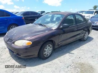 1999 Hyundai Elantra z VIN KMHJF25F1XU806648, wystawiony jako IAAI lot #42331073 z przebiegiem 196 577 mil mil oraz . Historia ofert i sprzedaży dostępna na DreamBid. Obrazek 2.