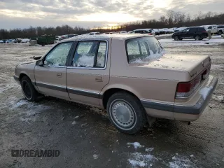 1989 Plymouth Acclaim z VIN 1P3BA46K6KF514487, wystawiony jako Copart lot #86534244 z przebiegiem 90 135 mil mil oraz Szkody całkowita. Historia ofert i sprzedaży dostępna na DreamBid. Obrazek 2.
