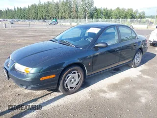 2000 Saturn SL z VIN 1G8ZK5271YZ165467, wystawiony jako IAAI lot #42367156 z przebiegiem 185 962 mil mil oraz . Historia ofert i sprzedaży dostępna na DreamBid. Obrazek 2.
