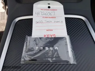 2023 Tesla Model Y Long Range with VIN 7SAYGDEE5PA035722, listed as a IAAI auction lot 41726067 with 34,357 mi miles. Bid and sale history available at carsss.com. Image 11.