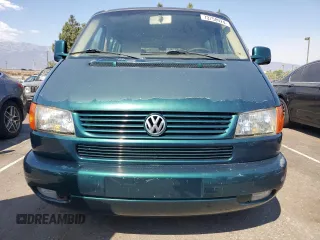 2003 Volkswagen EuroVan с VIN WV2KB47043H001319, выставлен на аукционе Copart как лот 73758024 с пробегом 88 497 миль миль и Чистый • Clean title. История ставок и продаж доступна на DreamBid. Изображение 5.