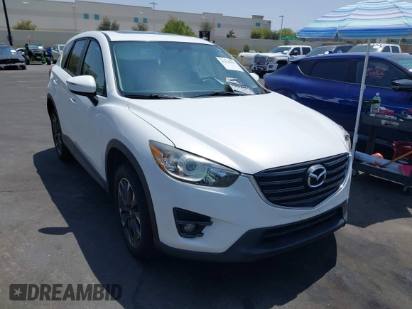 2016 Mazda CX-5 Grand Touring z VIN JM3KE2DY2G0824802, wystawiony jako IAAI lot #42170591 z przebiegiem 53 173 mil mil oraz . Historia ofert i sprzedaży dostępna na DreamBid. Obrazek 13.