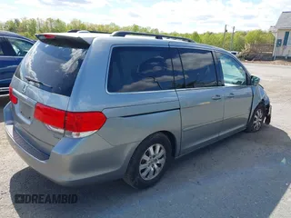 2010 Honda Odyssey EX-L with VIN 5FNRL3H74AB046578, listed as a IAAI auction lot 42049213 with 218,457 mi miles. Bid and sale history available at carsss.com. Image 4.