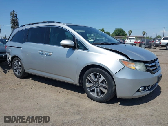 2014 Honda Odyssey Touring with VIN 5FNRL5H91EB068427, listed as a IAAI auction lot 42163315 with 184,134 mi miles and . Bid and sale history available at DreamBid. Image 14.