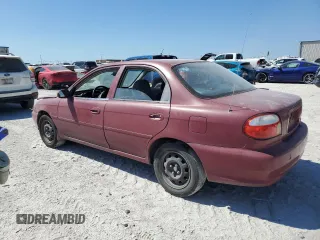 2001 Kia Sephia z VIN KNAFB121115074609, wystawiony jako Copart lot #72346144 z przebiegiem 88 400 mil mil oraz Tytuł czysty. Historia ofert i sprzedaży dostępna na DreamBid. Obrazek 2.